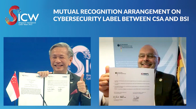 BSI-Vizepräsident Dr. Gerhard Schabhüser und CEO der Cyber Security Agency Singapore (CSA), David Koh unterzeichnen bilaterale Vereinbarung